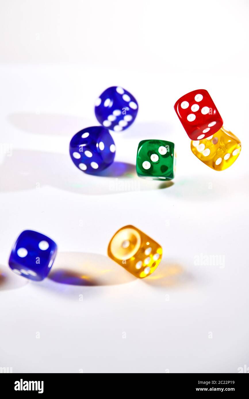 colorful dices in motion on white background Stock Photo