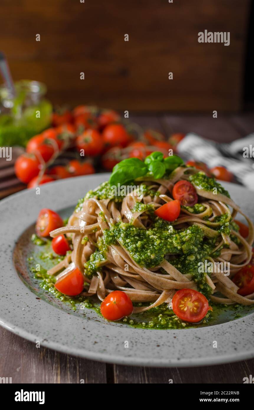 Pasta with basil pesto and parmesan, french parmesan basil pesto with garlic Stock Photo