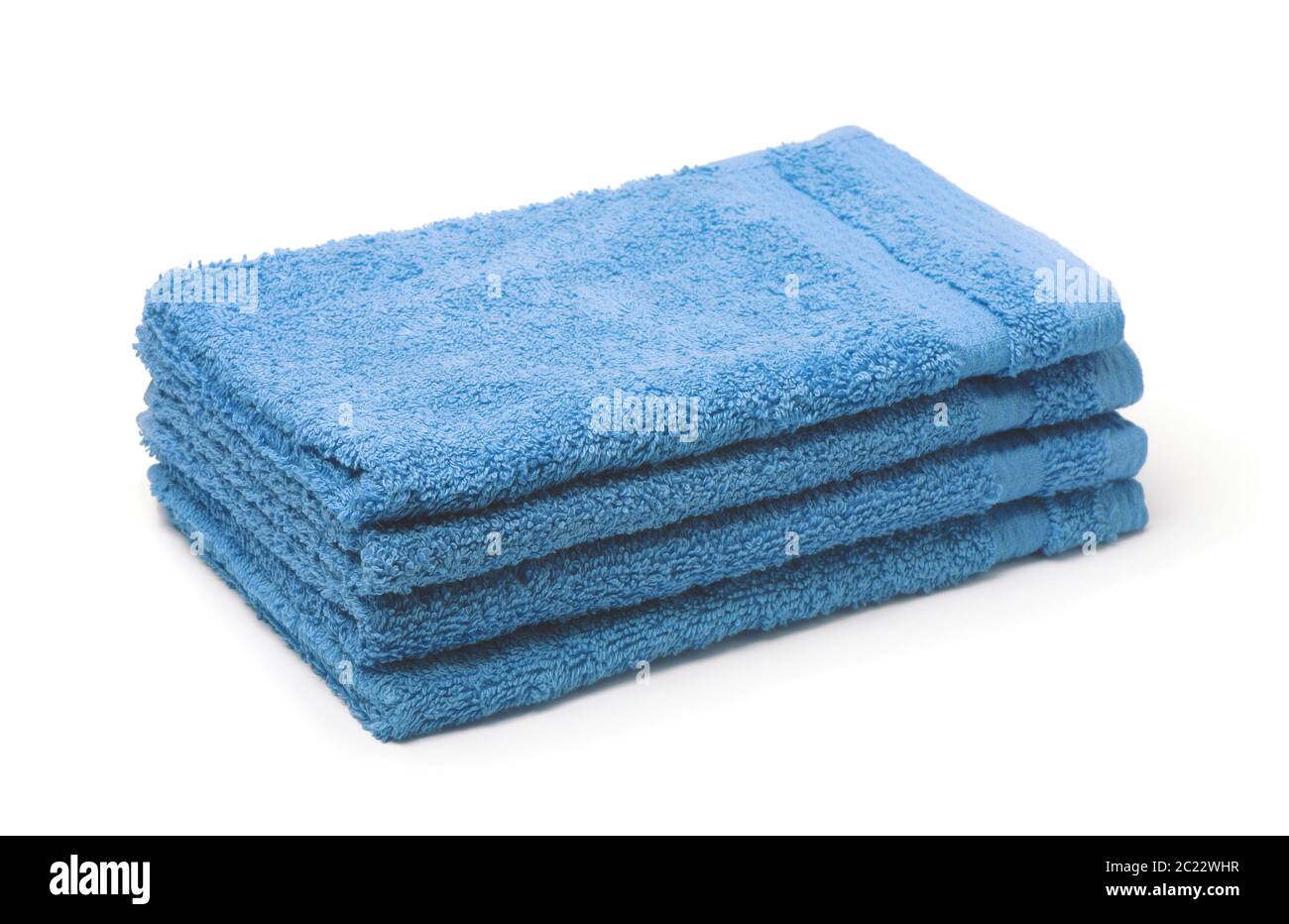 Stack of blue soft terry towels isolated on white Stock Photo