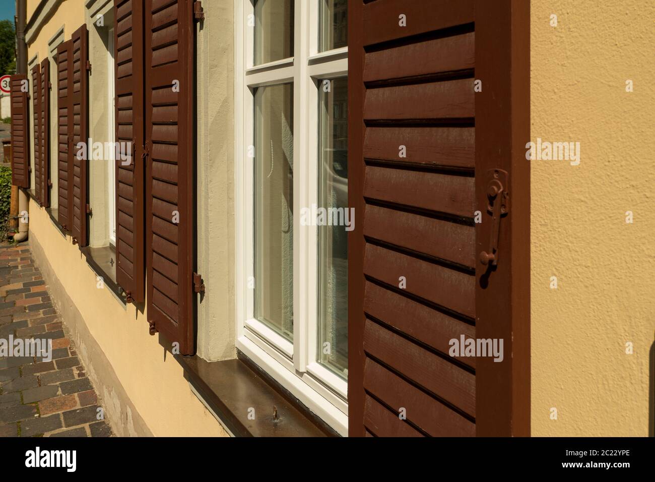 House facade with window with wooden shutter Stock Photo - Alamy