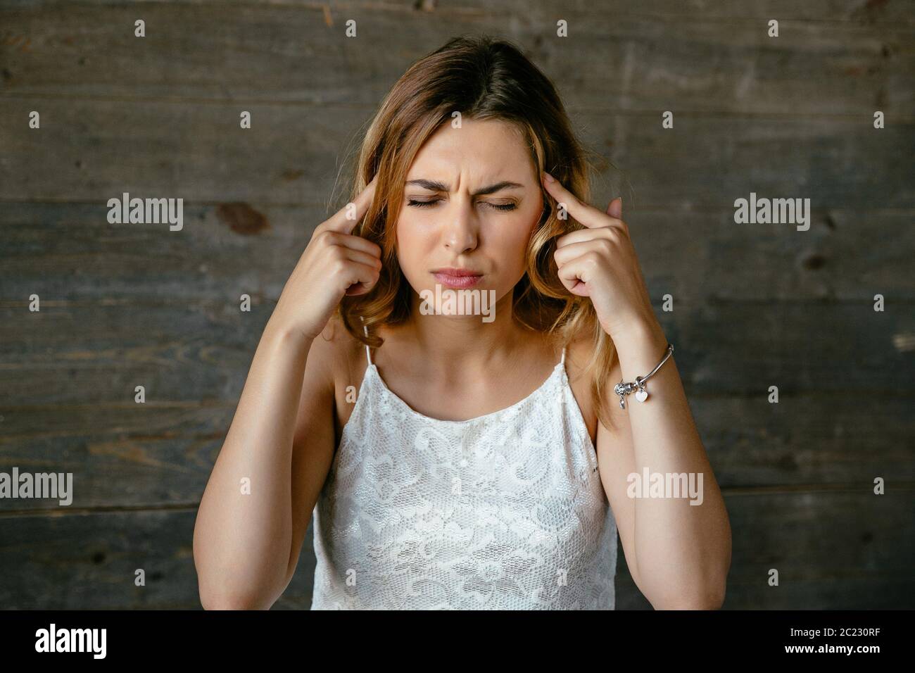 Hands on temples hi-res stock photography and images - Alamy