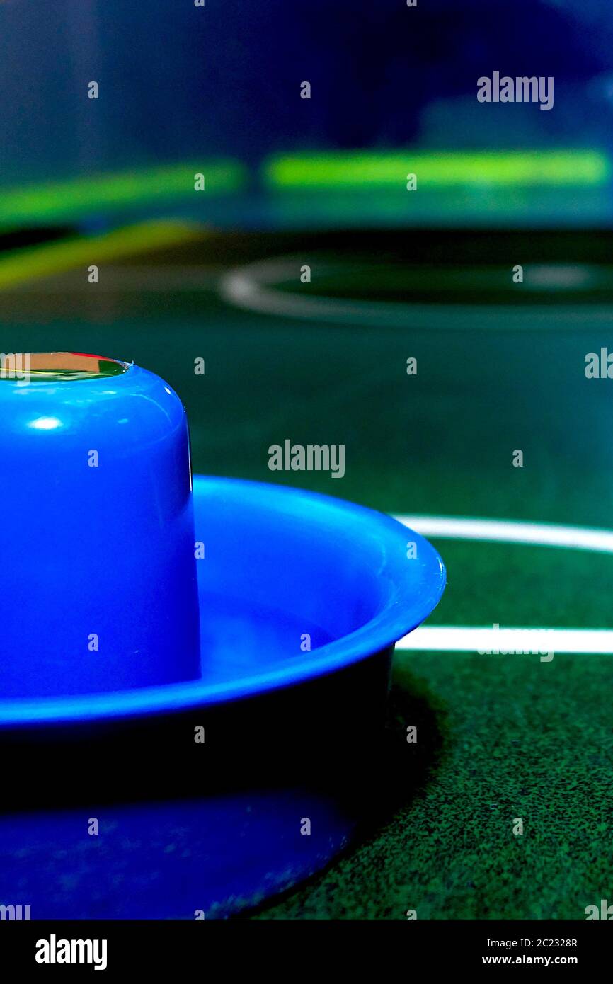 Bright and brilliant air hockey table with instruments for playing. Stock Photo