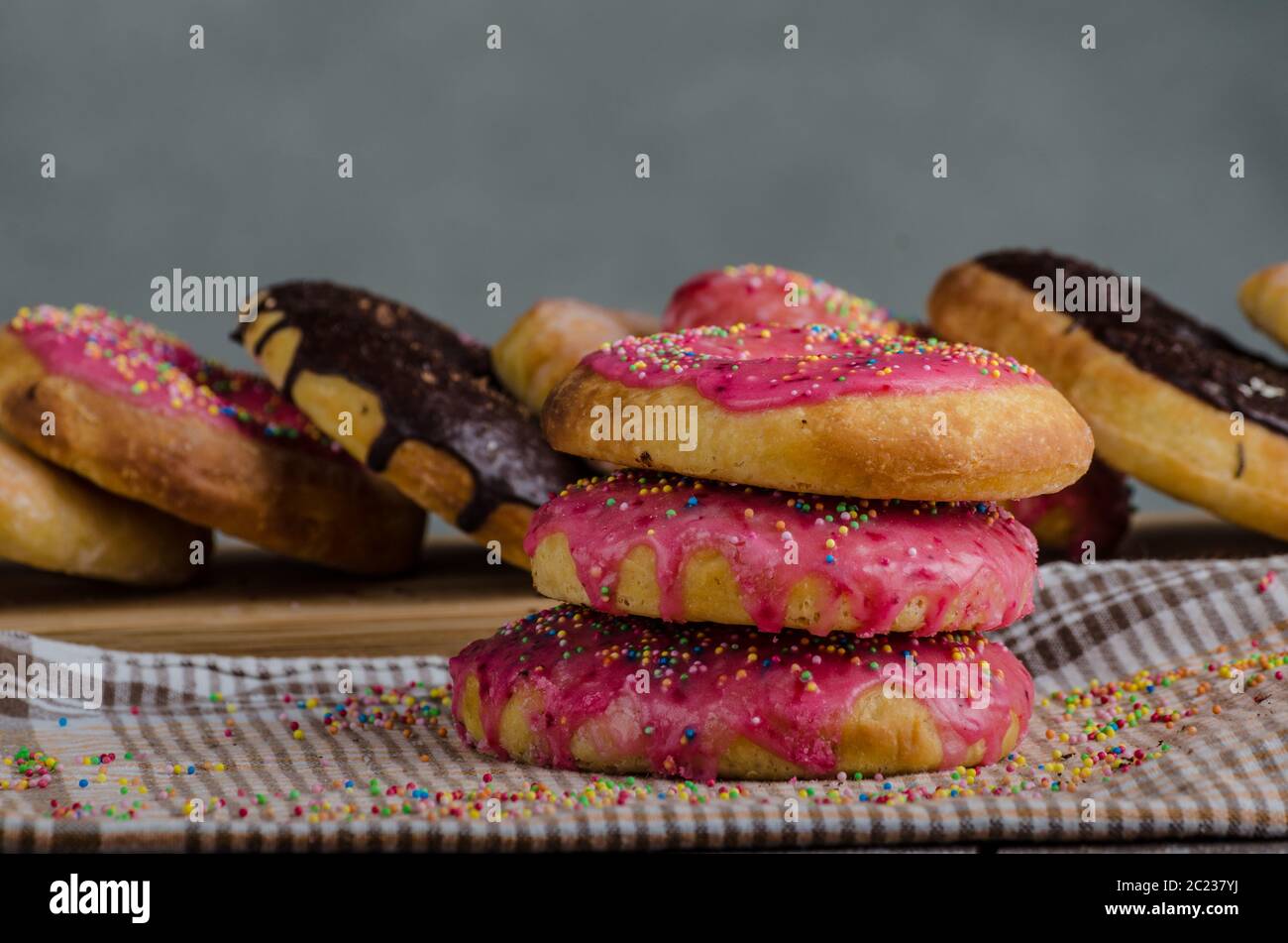 Homemade donuts, big one for bigger hunger, chocolate pinky and suger,  american cap morning, place for advertising Stock Photo - Alamy