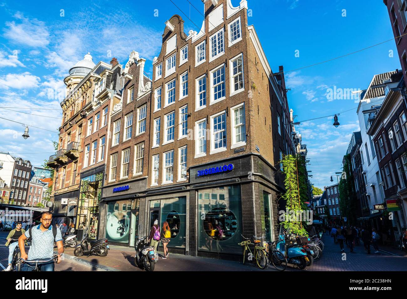 Amsterdam, Netherlands - September 9, 2018: Shopping street with people around and Shoebaloo shop in the old town of Amsterdam, Netherlands Stock Photo