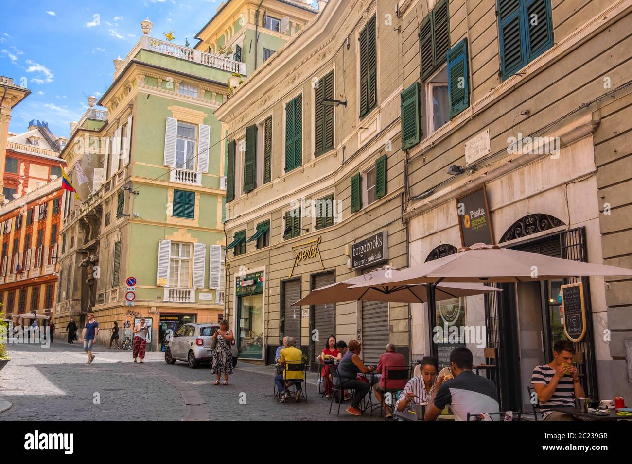 Genoa, Italy - August 20, 2019: Tourists and locals in street cafe on Piazza della Meridiana square in Genova, region of Liguria, Italy Stock Photo