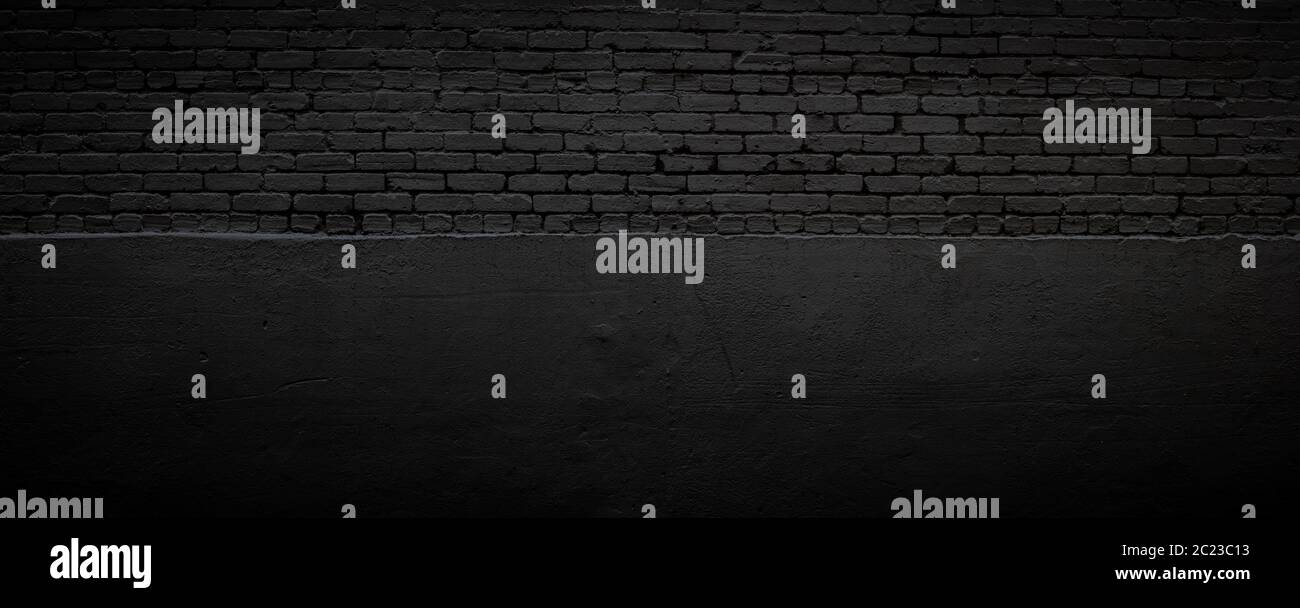 Black brick and stucco background, subtle textured backdrop, creative vignette copy space, horizontal aspect Stock Photo