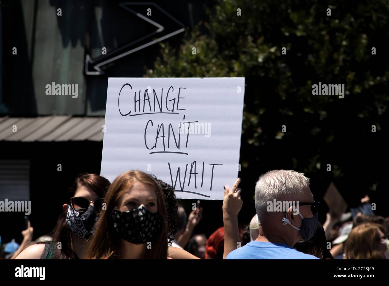 05-30-2020 Tulsa USA Change Can't Wait sign at BLM protest with blurred protesters  around it Stock Photo