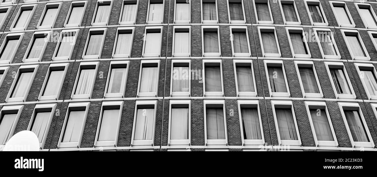 Vintage architectural patterns from rows of same size windows in monochrome. Stock Photo