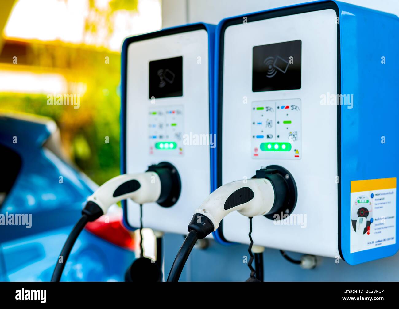 Electric car charging station. Plug for vehicle with electric motor. Coin-operated charging station. Clean energy power. Commercial charging station. Stock Photo