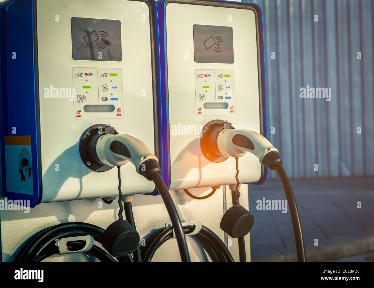 Electric car charging station. Plug for vehicle with electric motor. Coin-operated charging station. Clean energy power. Commercial charging station. Stock Photo