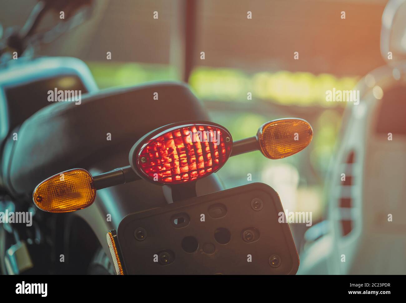 Motorcycle break and turn signal light on blurred background. New big bike  park in showroom. Motorbike dealership concept. Parts of motorcycle. Motorc  Stock Photo - Alamy