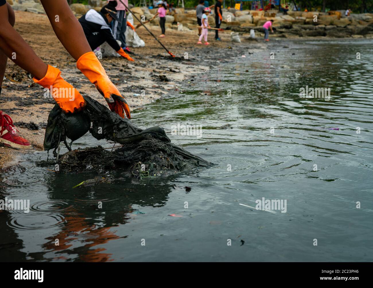 asia-and-litter-collecting-and-beach-hi-res-stock-photography-and
