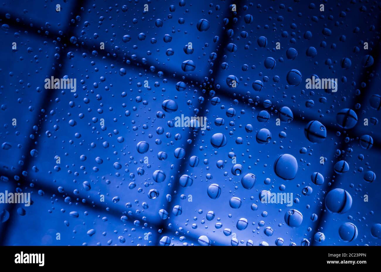 Blue abstract blur background with water drops and reflection on  transparent glass. Blue background for lonely, sad and missing someone on  rainy day c Stock Photo - Alamy