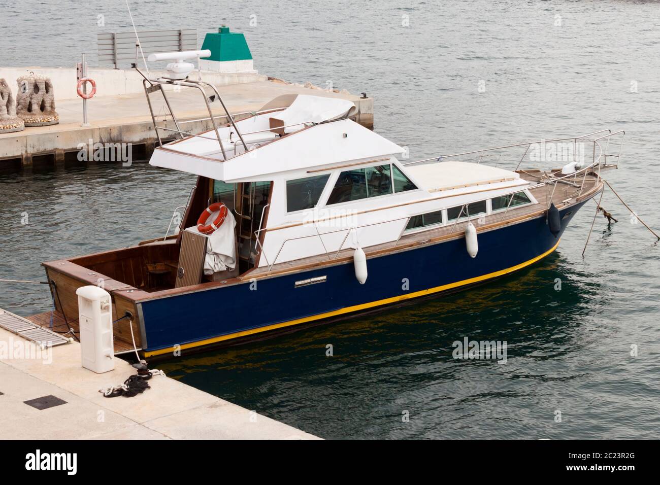 Recreational old wooden yacht moored in the pier Stock Photo - Alamy