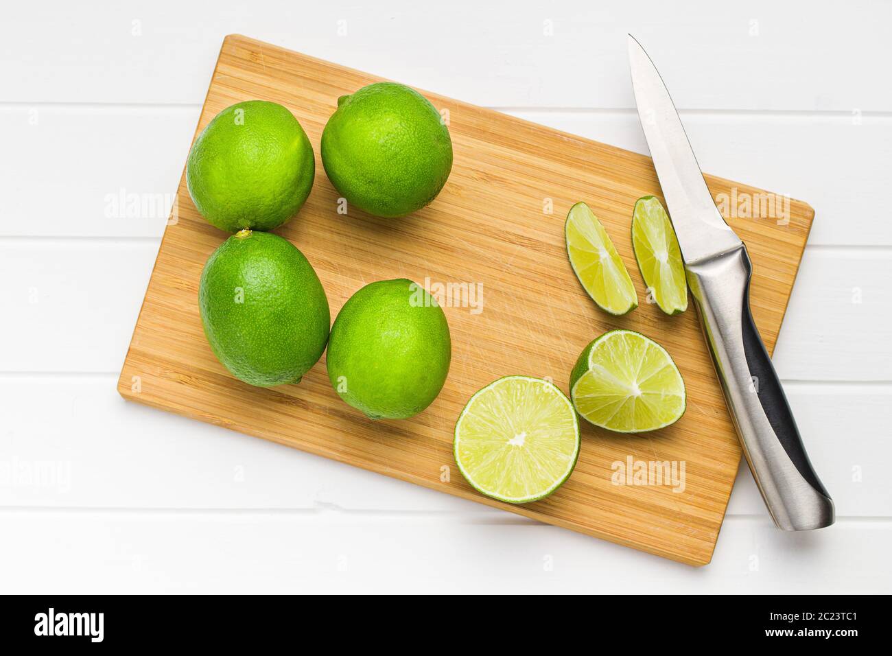 The green sliced lime on cutting board. Stock Photo