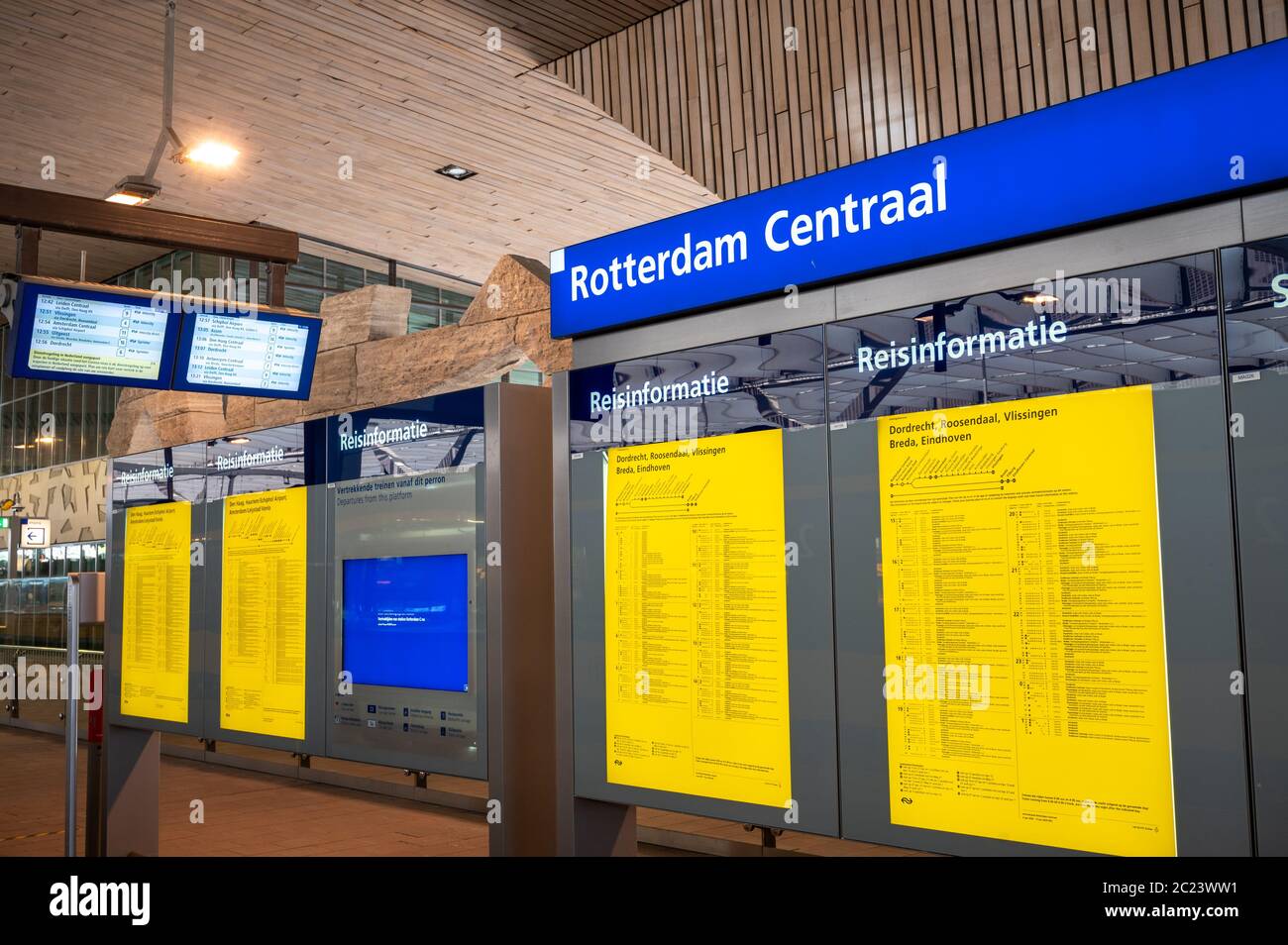 Information boards inside Rotterdam Centraal train station in the Netherlands Stock Photo