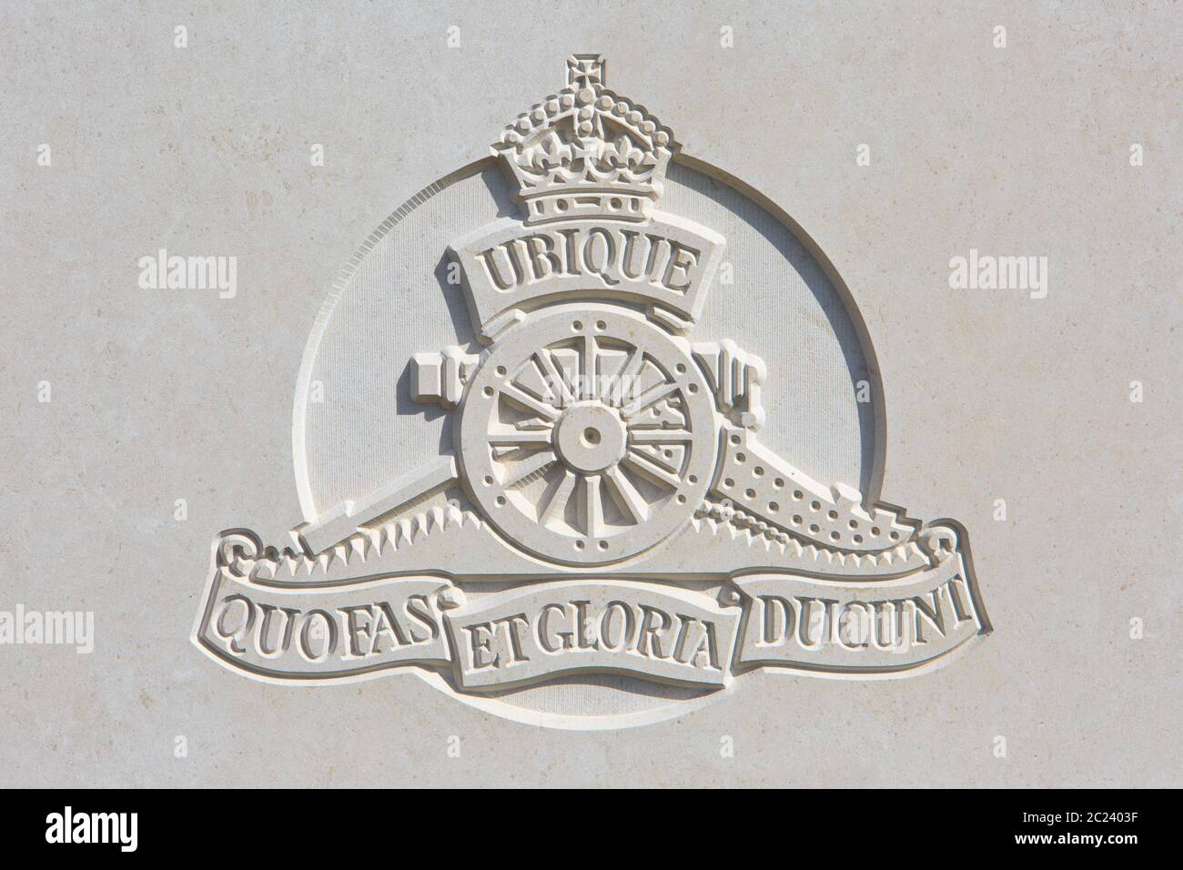 The Royal Field Artillery (1899-1924) regimental emblem on a World War I headstone at Bedford House Cemetery in Zillebeke, Belgium Stock Photo