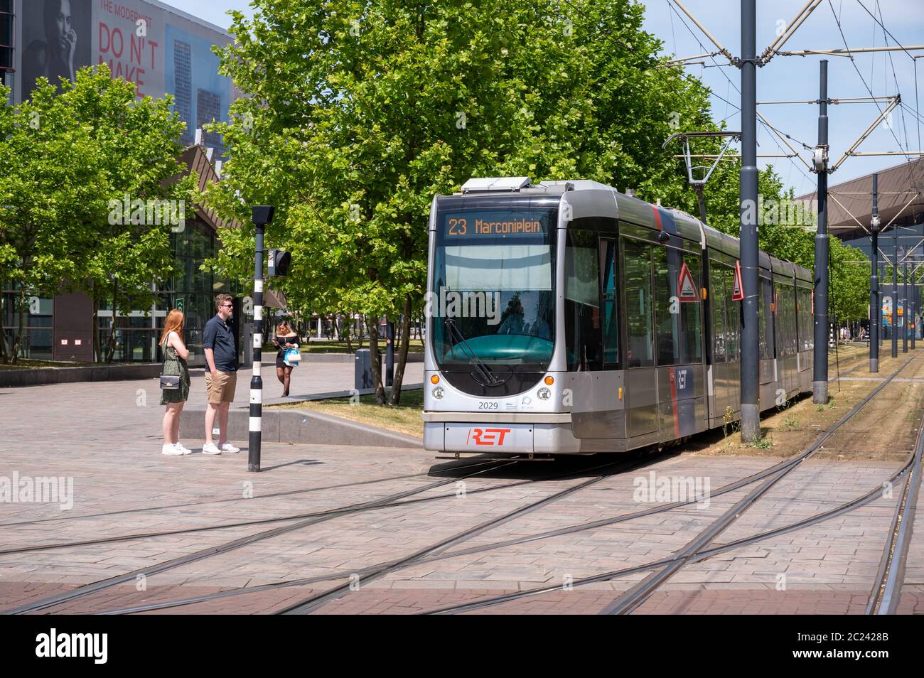 Tram on Kruisplein in the centre of Rotterdam, Netherlands. People visible. Stock Photo