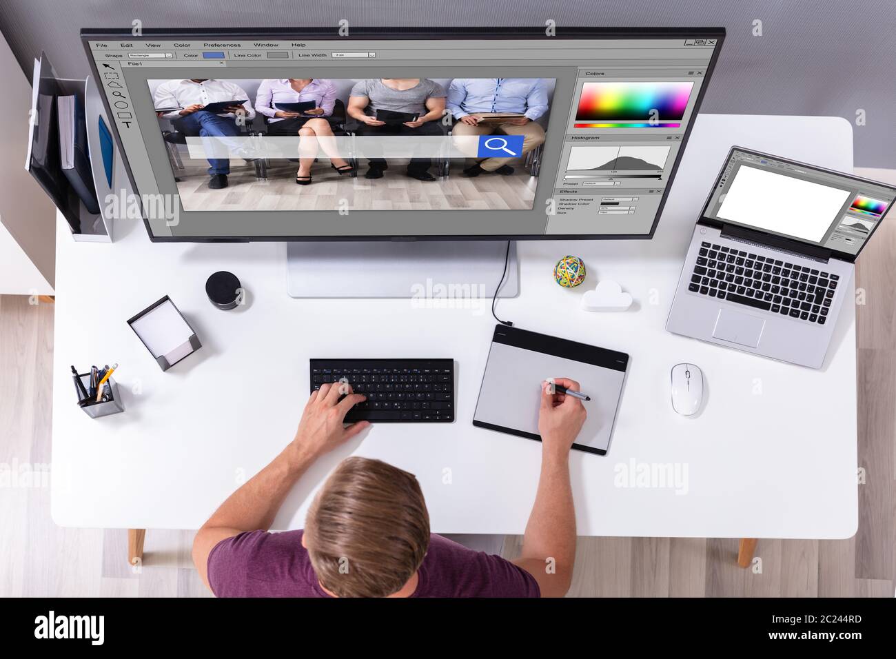Designer Editing Photo On Computer In Office Stock Photo