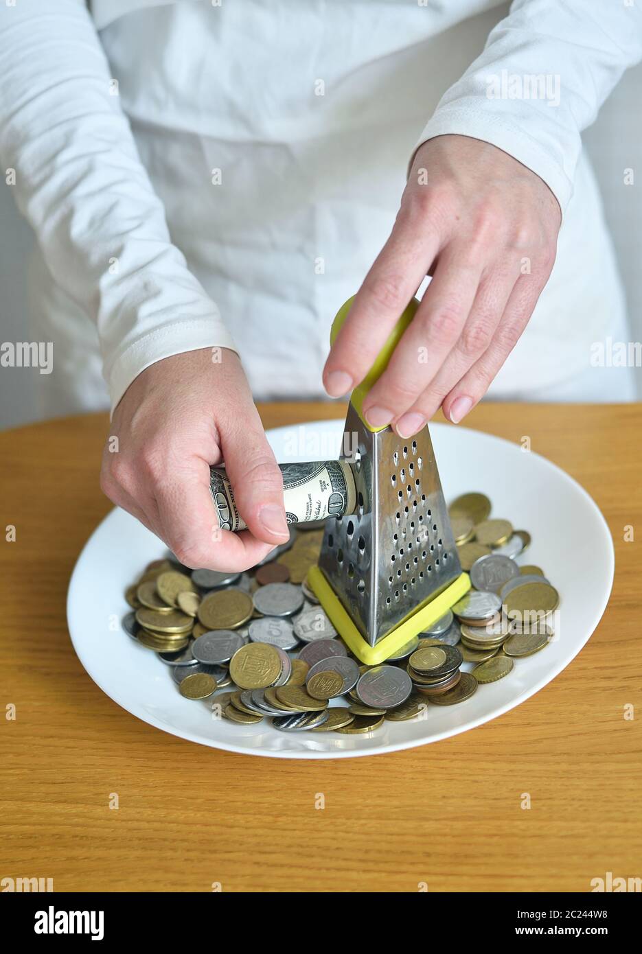 exchange dollars for cents using a grater Stock Photo
