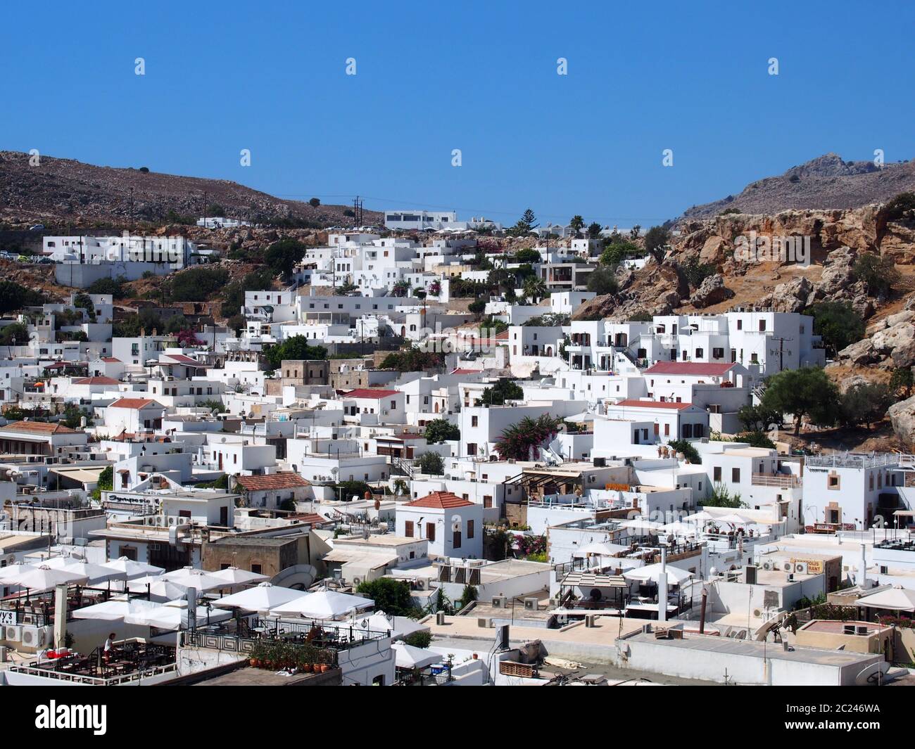 view of afandou village in rhodes with blue sky and mountains Stock Photo