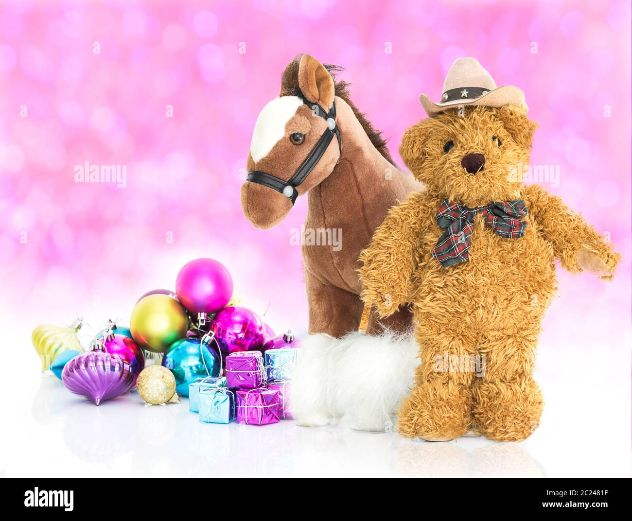 Teddy bear with gifts and ornaments christmas and new year on red bokeh ...