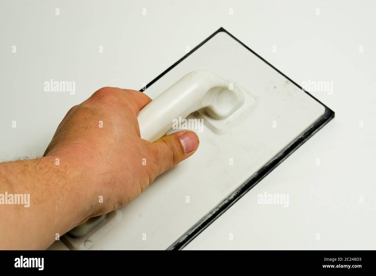 Moss rubber pad for grouting tiles Stock Photo Alamy