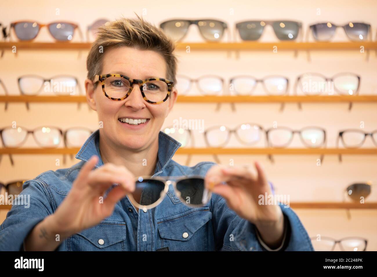 woman in a eyewear store Stock Photo