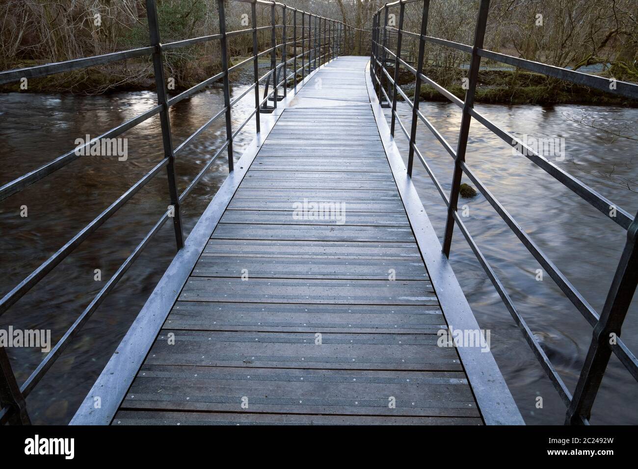 The new metal bridge over River Rothay near Grasmere in autumn, Cumbria, UK Stock Photo