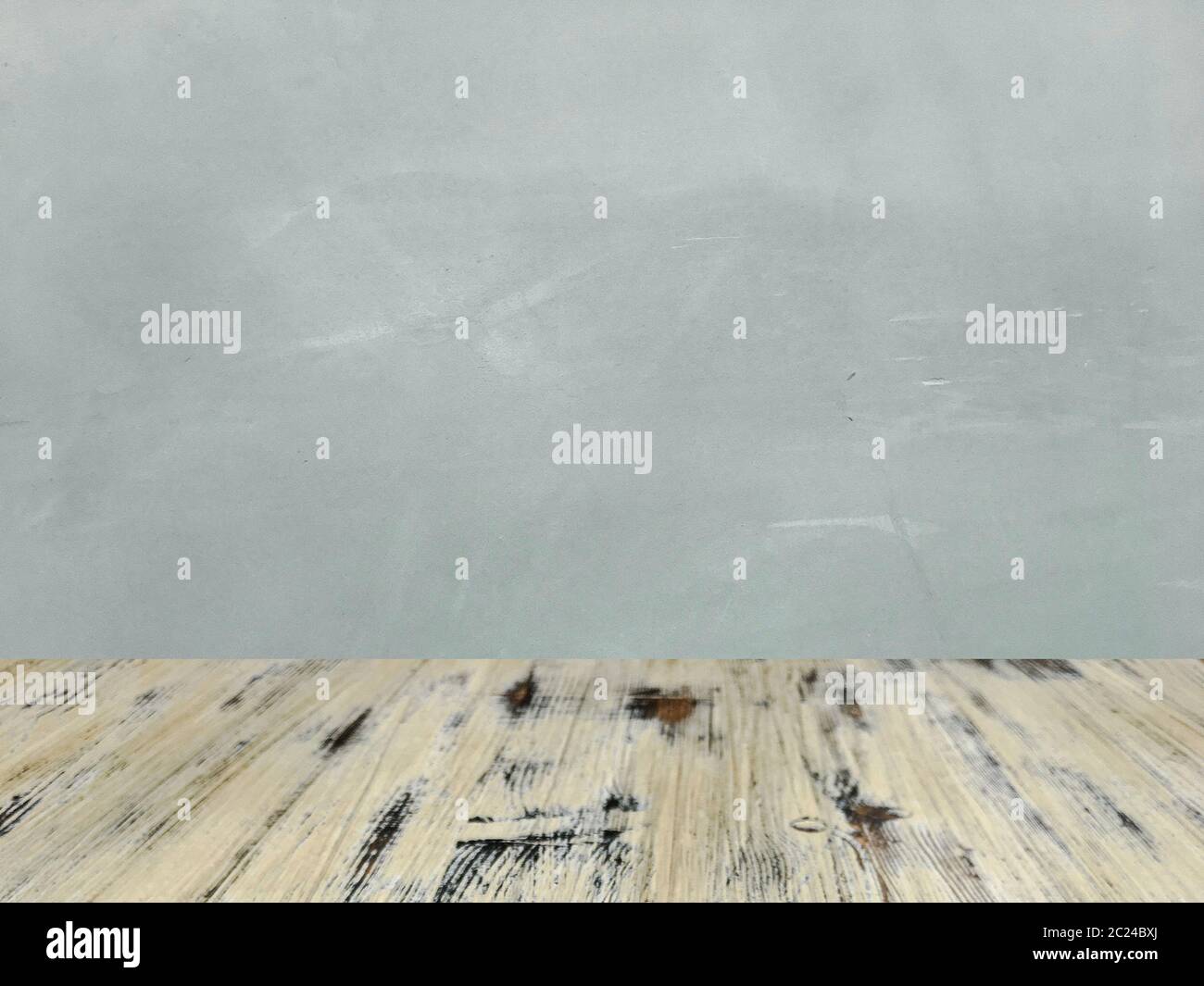 washed wood table with concrete texture background. Stock Photo