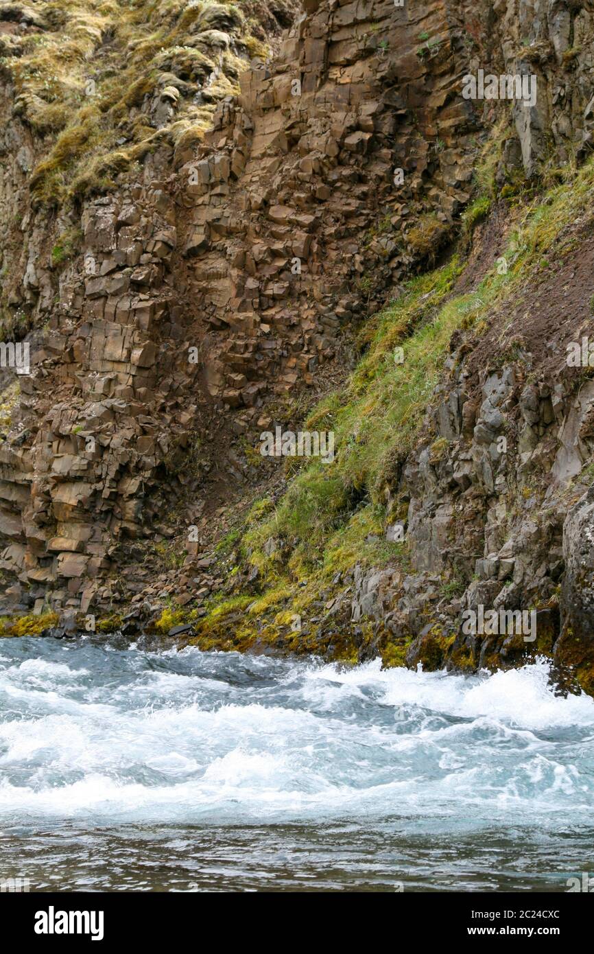 Rough nature with torrent on a steep rock face Stock Photo
