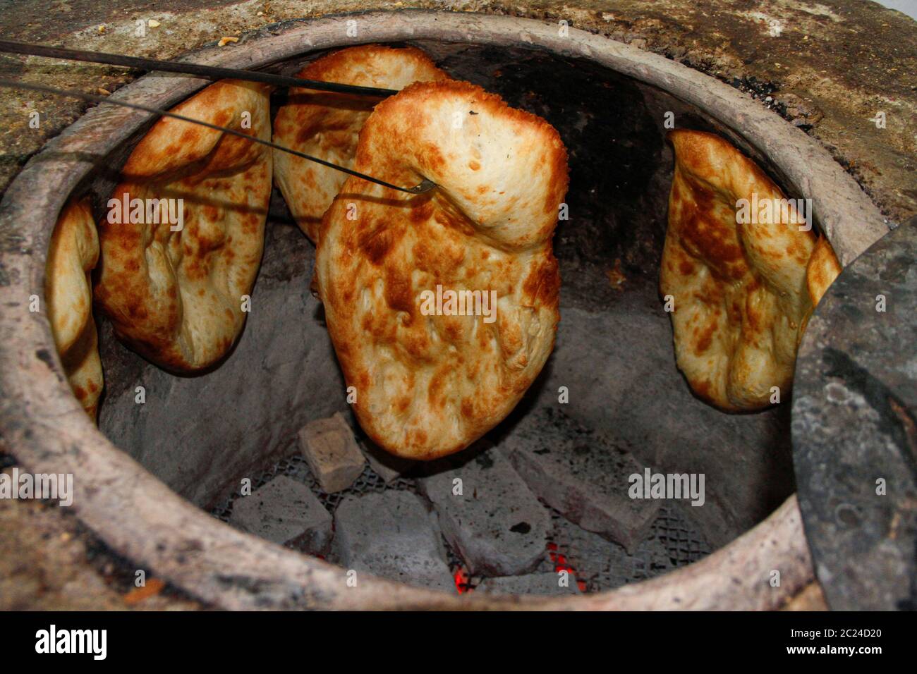 Traditional caucasian tandir bread cooking Stock Photo