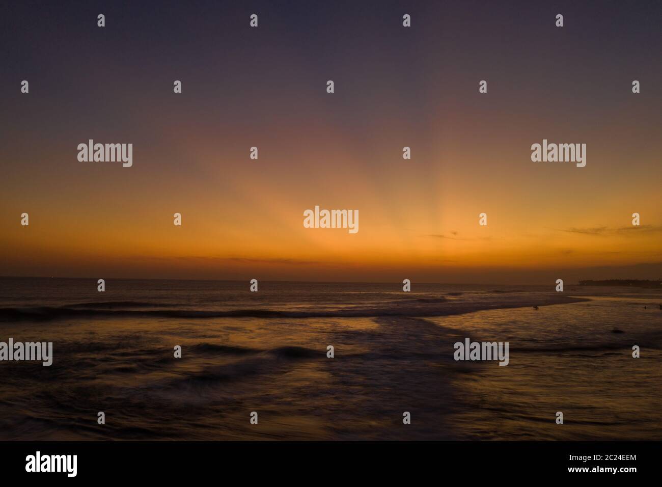 Aerial drone view of the sea over beautiful golden sunset sky ...