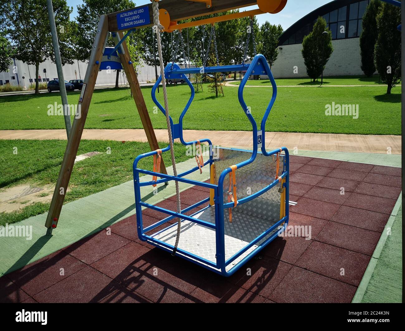 swing for the disabled inserted in the amusement park Stock Photo