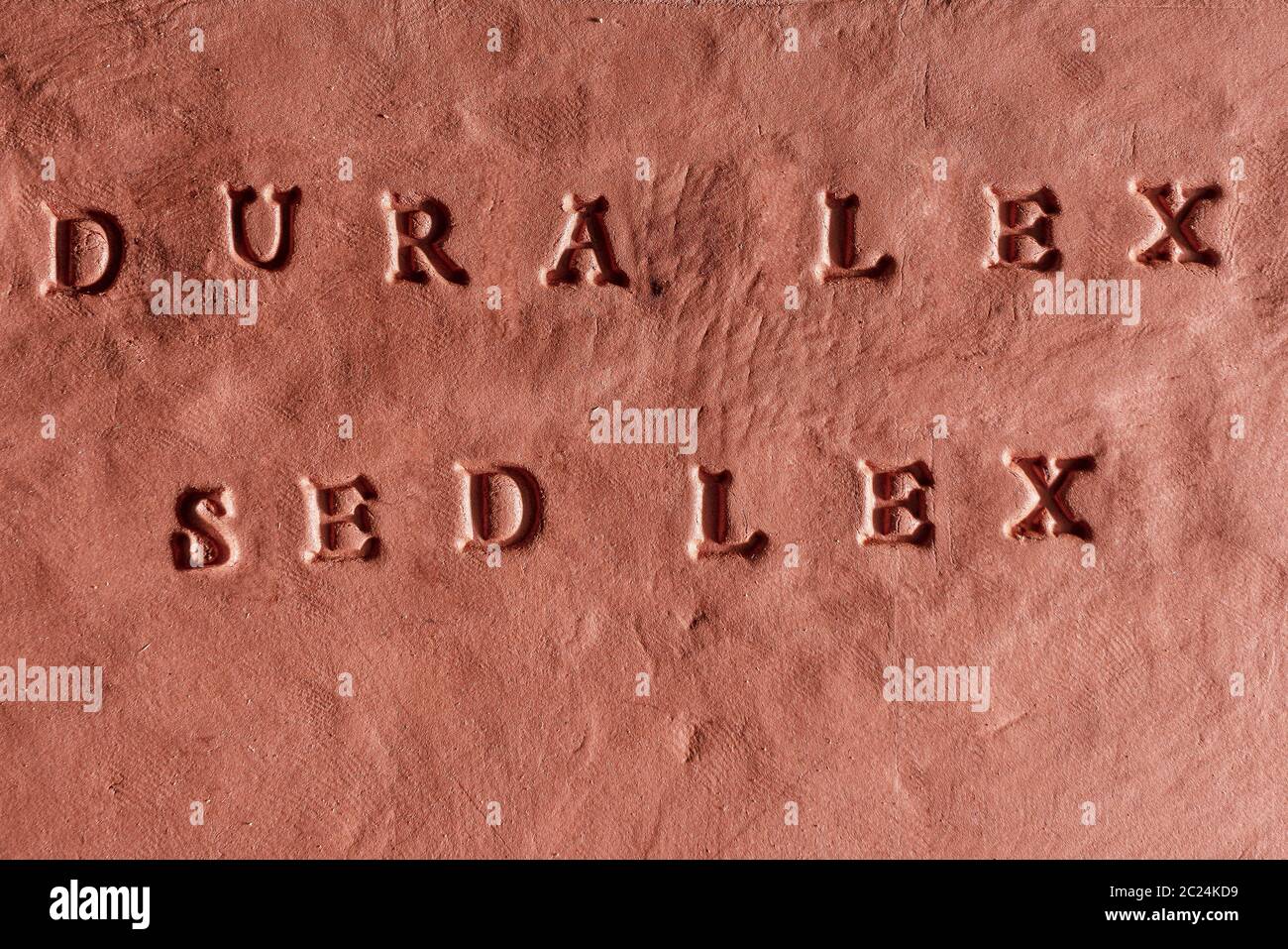 the phrase Dura lex, sed lex written in Latin language on a terracotta  tablet Stock Photo - Alamy