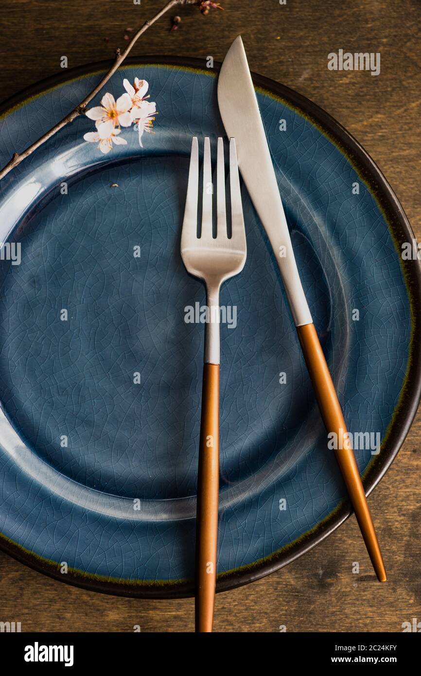 Spring table setting with blooming tree branch Stock Photo