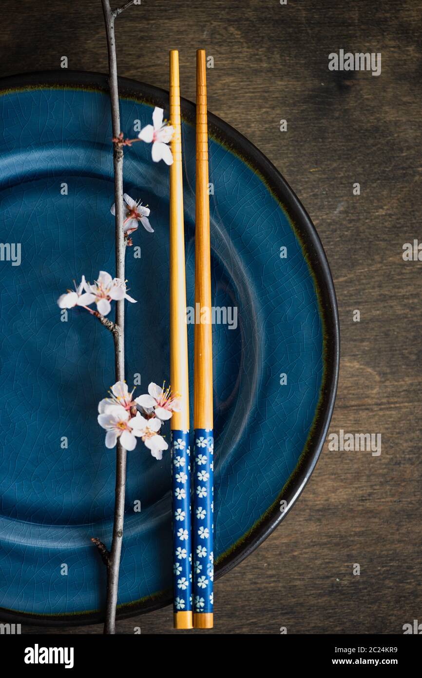 Spring table setting with blooming tree branch Stock Photo