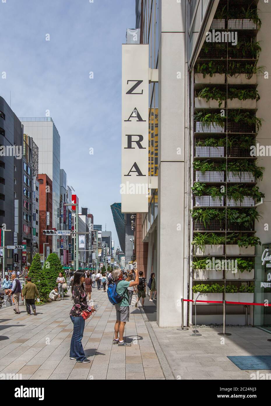 People in front of Zara store front, Ginza Street, Tokyo, Japan Stock Photo