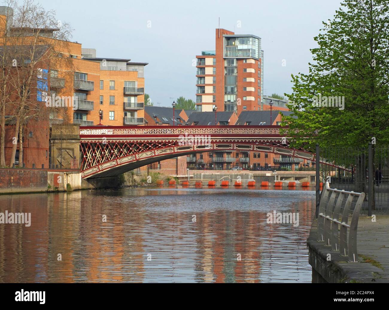 crown point bridge crossing the river aire in leeds with surrounding waterside buildings Stock Photo