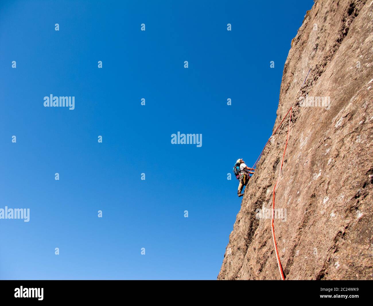 Rock climber climbing a sloping rock wall in Brazil Stock Photo Alamy