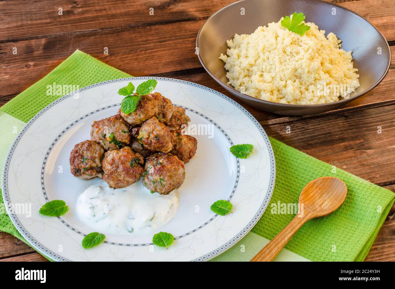 Beef meatballs with cilantro, garlic, couscous and mint dip Stock Photo