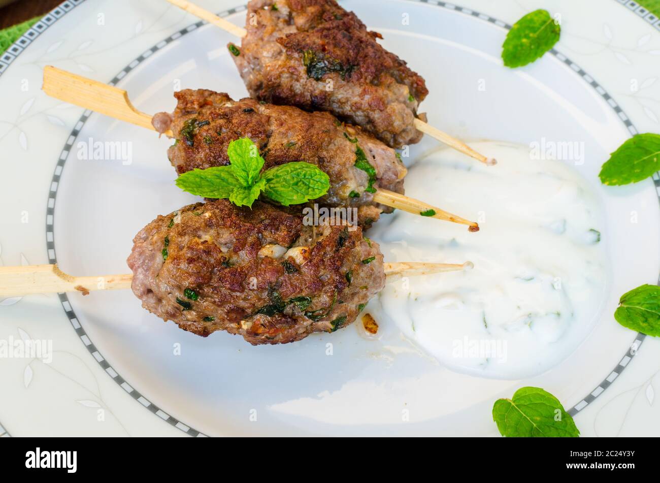 Beef kebab with coriander, garlic, couscous and mint dip Stock Photo Alamy