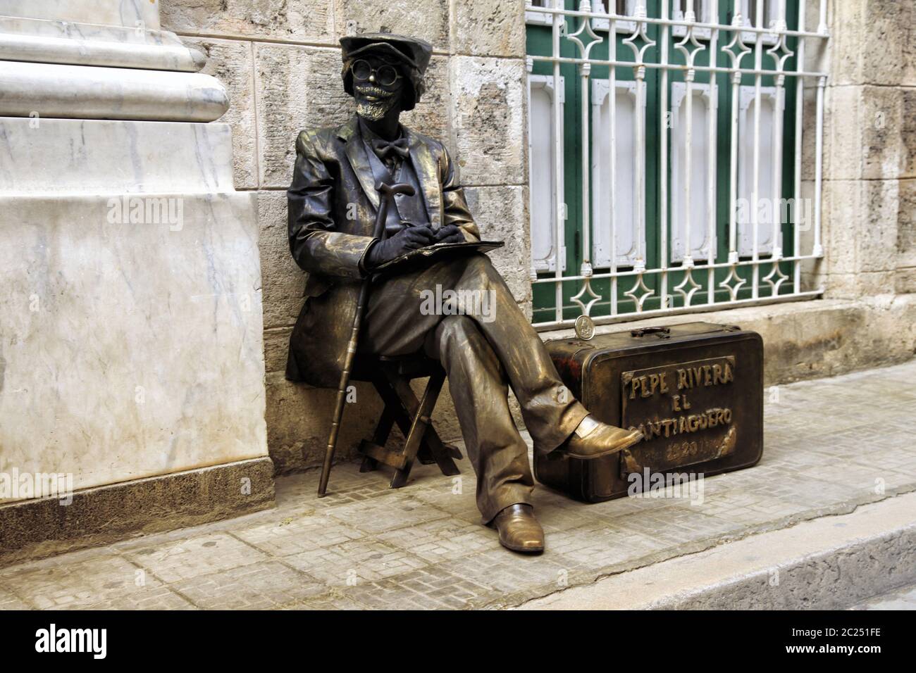 Bronze painted artist on a city street. Havana, Cuba Stock Photo