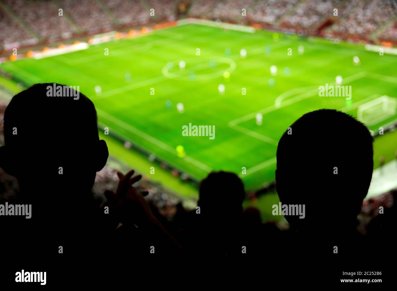 Soccer stadium with people watching game in progress Stock Photo