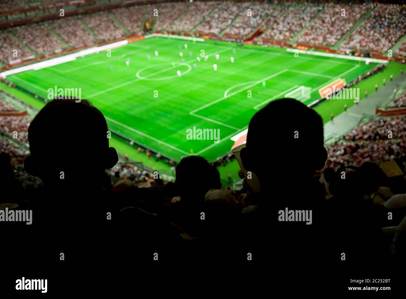 Soccer stadium with people watching game in progress Stock Photo