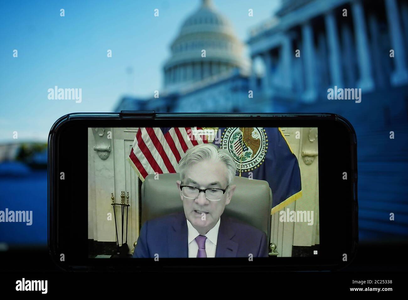 Washington, USA. 16th June, 2020. Photo taken on June 16, 2020 shows the live broadcast of U.S. Federal Reserve Chairman Jerome Powell attending a virtual hearing before the Senate Committee on Banking, Housing, and Urban Affairs in Washington, DC, the United States. The U.S. economy may be entering a phase of bouncing back, with the easing of social distancing measures and resumption of business activities, but employment and output will be 'well short' of the pre-pandemic level, Federal Reserve Chairman Jerome Powell said on Tuesday. Credit: Liu Jie/Xinhua/Alamy Live News Stock Photo