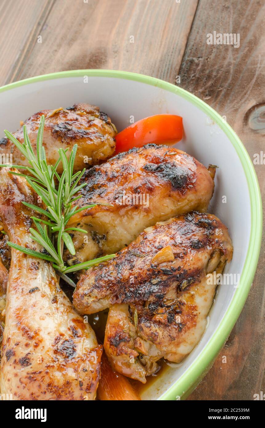 Baked chicken with lemon pepper butter sauce hires stock photography