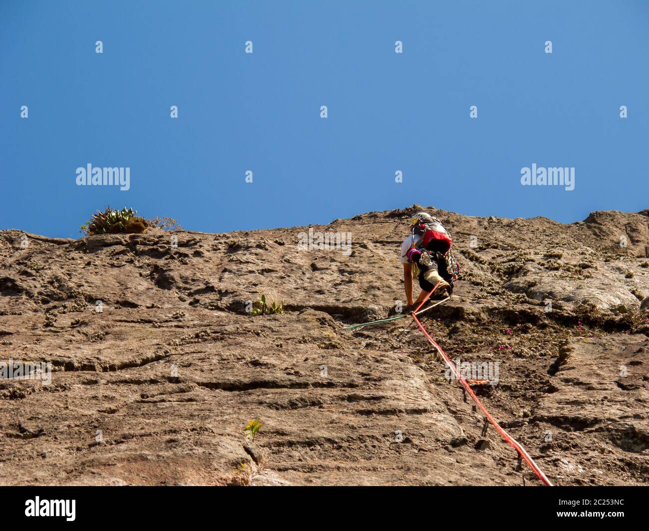 Rock climber climbing a sloping rock wall in Brazil Stock Photo Alamy