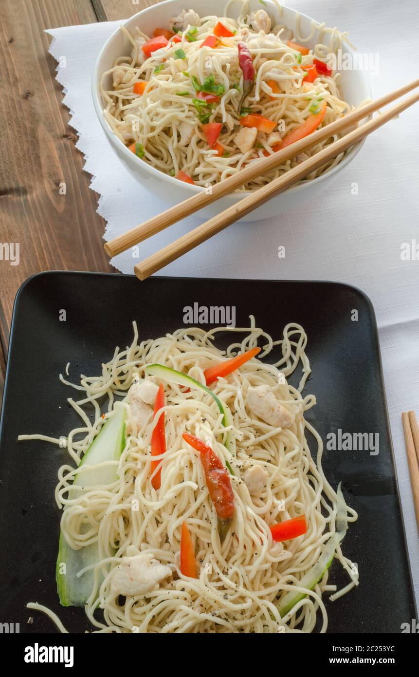 Chinese noodles, fast but delicious food with chopsticks Stock Photo
