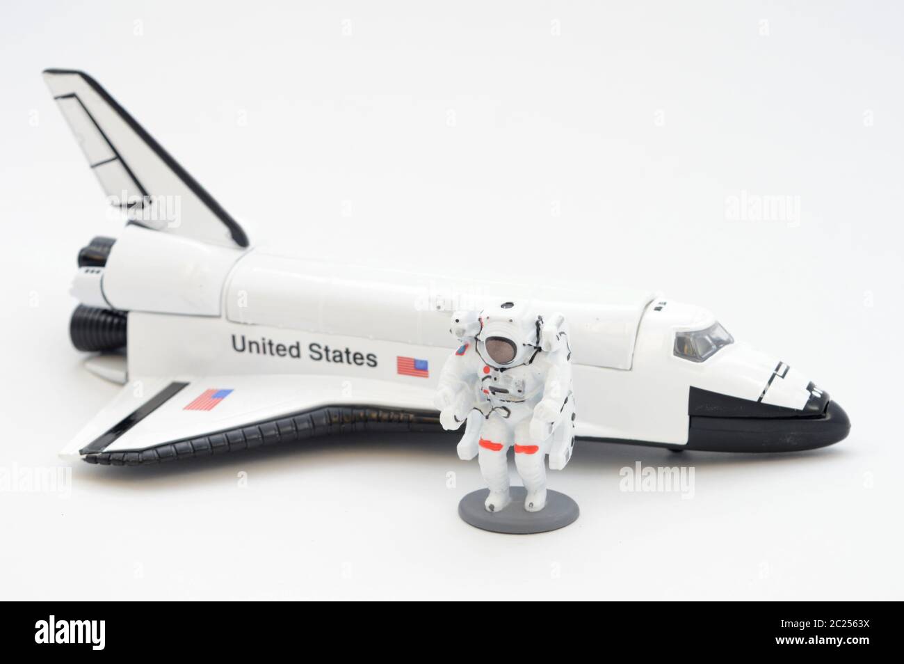 A scale model of an American spaceship and an Astronaut that holds true